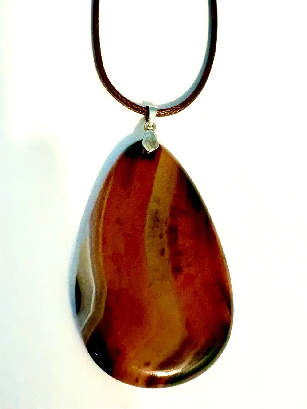 Beautiful, Geode Agate, pendant on a brown leather cord.